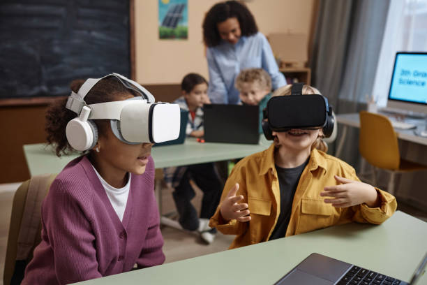 istock Children wearing VR headsets in class 1983164966