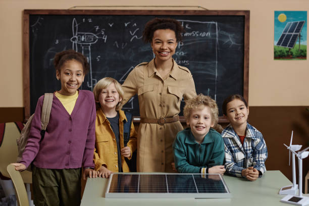 istock Teacher with Diverse Group of Children Smiling at Camera 1983165509
