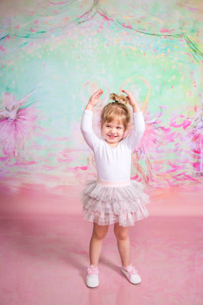 istock Cute Little Ballerina Doing Exercises Set in the studio 1983166050