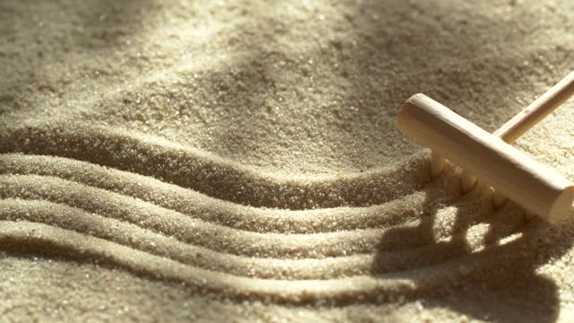 Close-up making sand zen garden