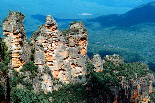 Blue Mountains, NSW, Australia: the iconic Three Sisters sandstone rock formation, set against the lush eucalyptus forests of Australia's Blue Mountains National Park.