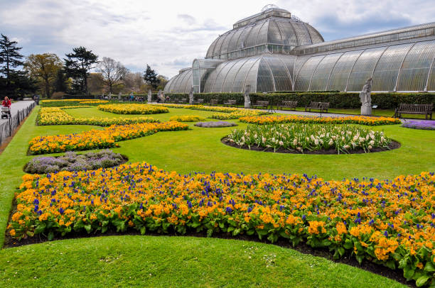 Greenhouse in Kew botanical gardens in spring, London, United Kingdom London, UK - April 2018: Greenhouse in Kew botanical gardens in spring kew gardens spring stock pictures, royalty-free photos & images