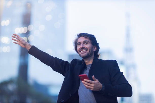 istock View of young man using a smartphone at twilight 1983234043