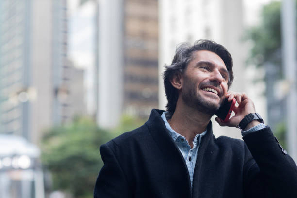 istock View of young man using a smartphone at twilight 1983249596