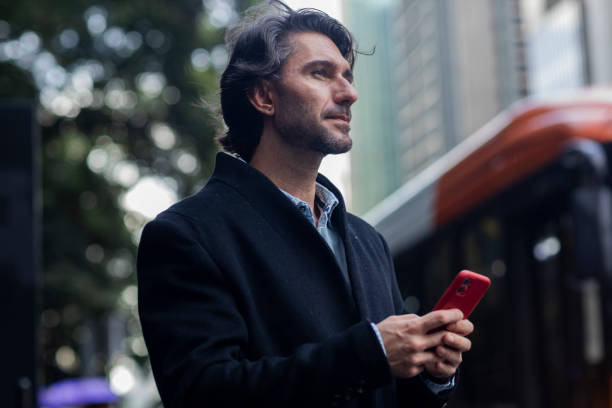 istock View of young man using a smartphone at twilight 1983251650