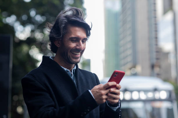 istock View of young man using a smartphone at twilight 1983263978
