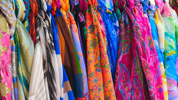 istock Multicolor family clothes on hangers in store 1983265537