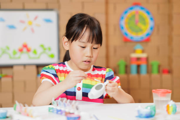 istock young girl making craft at home 1983292955
