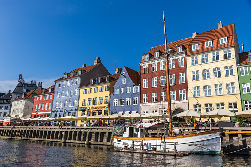 Copenhagen, Denmark - September 18, 2018: Cityscape of Nyhavn Pier with Colorful Buildings and Ships, Europe