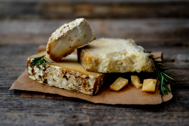 Homemade Goat Cheese On Craft Paper On An Old Rustic Table