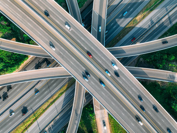 Directly Above I-440, I-65, Franklin Rd, and Train Tracks Crossing South of Nashville, Tennessee, USA Highways in Rural Areas: I-440, I-65, Franklin Rd, and Train Tracks South of Nashville, Tennessee, USA drone car on road stock pictures, royalty-free photos & images