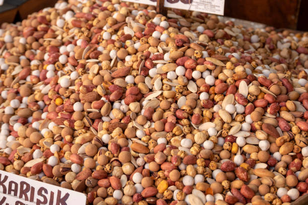 Fresh mixed nuts (hazelnuts, peanuts, roasted chickpeas, sunflower seeds, almonds, pistachios, etc.) sold openly in the market,