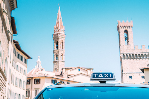Taxi Cab Waiting in Florence, Italy near Abbey of Florence - Monastery of Saint Mary of the Assumption.