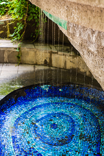 Water fontain with blue mosaic in the Mziuri park in Tbilisi's downtown