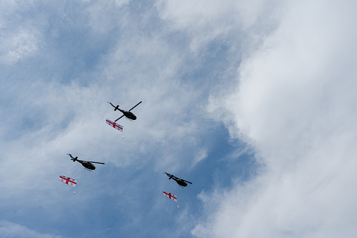 Helicopters with Georgian flags fly in the sky of Tbilisi city on the Independence Day of Georgia 26th if May 2023