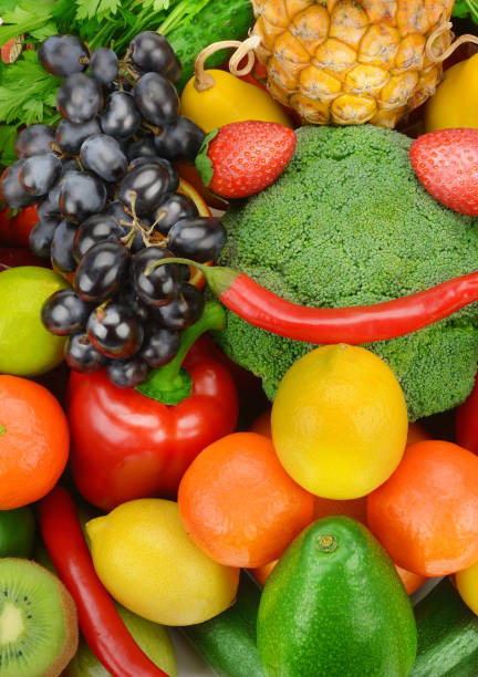 Beautiful bright background from various vegetables and fruits. Vertical photo.