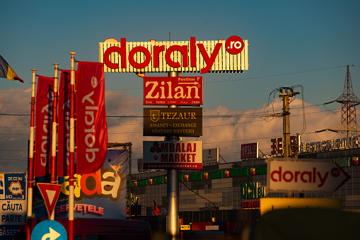Afumati, Romania - January 16, 2024: The Expo Market Doraly logo is seen on a high advertising pole.