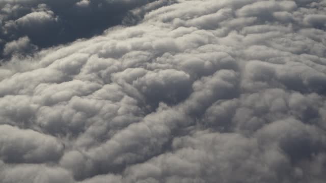 Scenic View Of Thick Clouds From The Airplane Window