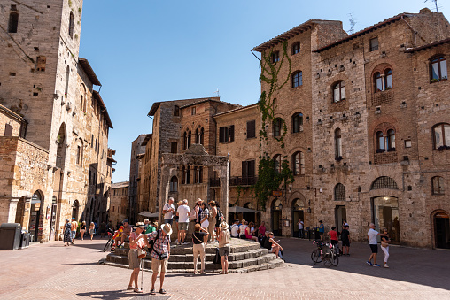 San Gimignano, Italy - September 20, 2023 - Piazza della Cisterna in downtown San Gimignano, Italy