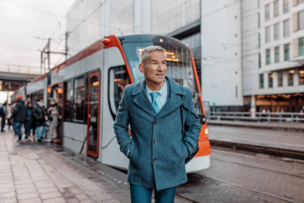 Handsome dutch businessman at a public transport hub