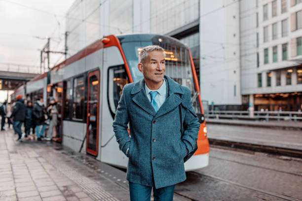 Handsome dutch businessman at a public transport hub stock photo