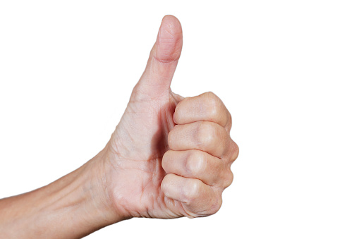 Close up of a hand in the thumbs up position