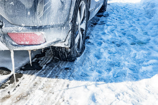 istock Very Flat Tire on Parked Car in Winter Snow and Ice 1983443241