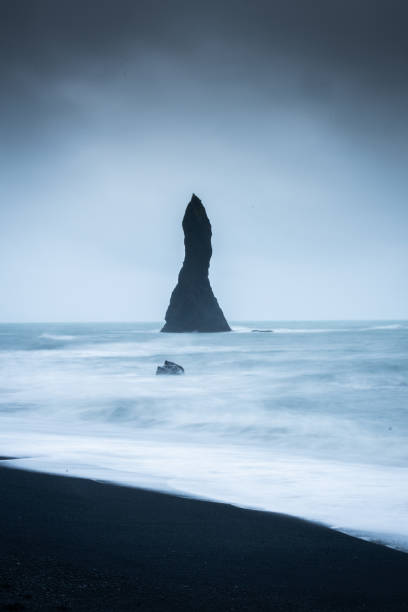 istock Black basalt sea stacks in Reynisfjara Black Beach, Vik,  Iceland 1983526106