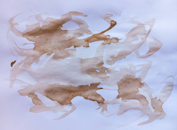 istock Abstract brown coffee grunge background. Hand made abstract artwork. Abstract brown paint wallpaper. Coffee stains, blobs and drops on white paper. 1983577108