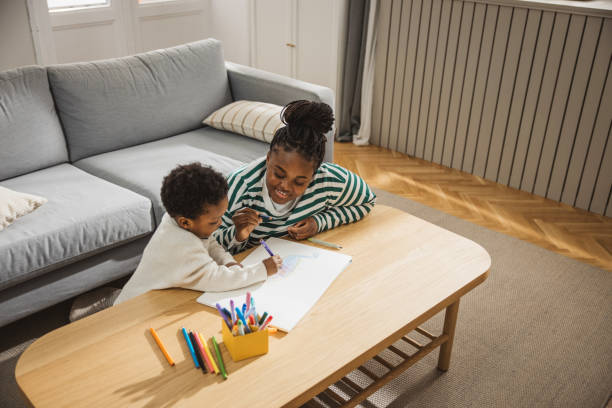 istock Mother and son coloring together 1983603362