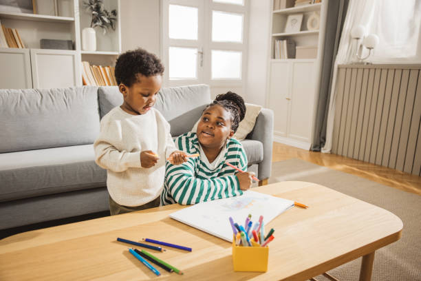 istock Mother and son coloring together 1983603365