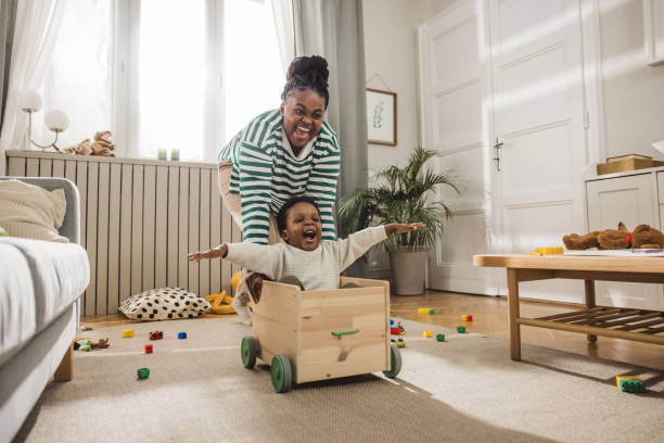 istock Mother playing with her son at home 1983604420