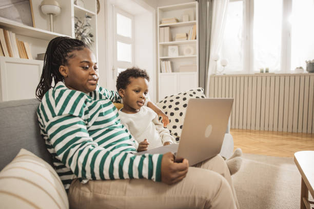 istock Mother and baby boy using laptop 1983607042