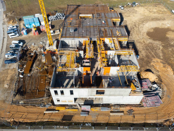 istock Aerial view of a construction site with crane and building materials. 1983639894