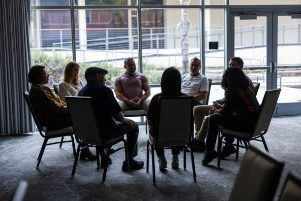 istock Wide shot of a group discussion at therapy 1983657786
