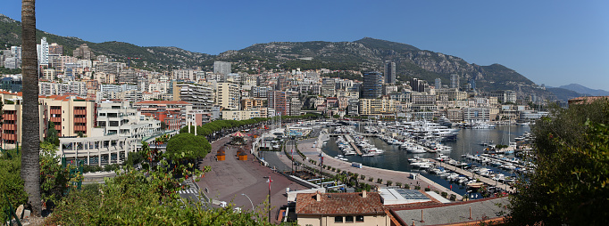 Aerial view of Port de Fontvieille - Monte Carlo in Monaco where, in addition to the Grande Casino, you see Yachts, Condominiums, Hotels, Mountains and Money which are all the symbols of this famous City.