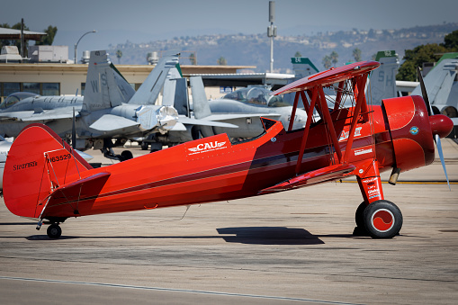 Miramar, California, USA - September 24, 2023: Vicky Benzing's Stearman sits on the tarmac between performances at America's Airshow 2023.