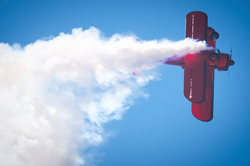Miramar, California, USA - September 23, 2023: Vicky Benzing inverts with smoke on at America's Airshow 2023.