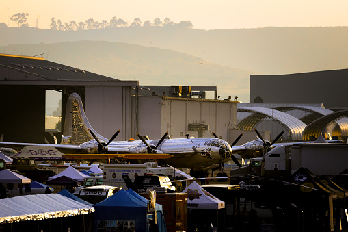 Miramar, California, USA - September 23, 2023: The sun rises on a B-29 named Doc as workers preparing for the opening of America's Airshow 2023