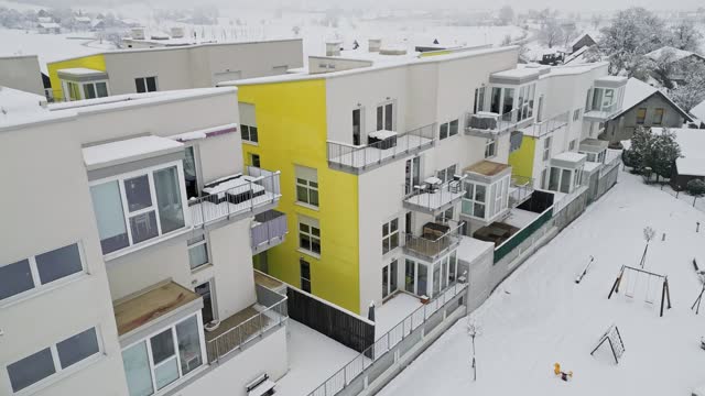 Newly build public apartments aerial view on a snowy day