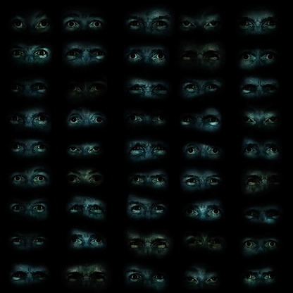 Rows of sinister eyes emerging from a dark background.