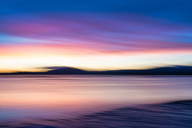 Background sunset intentional camera movement effect soft hues on morning light blue hour.