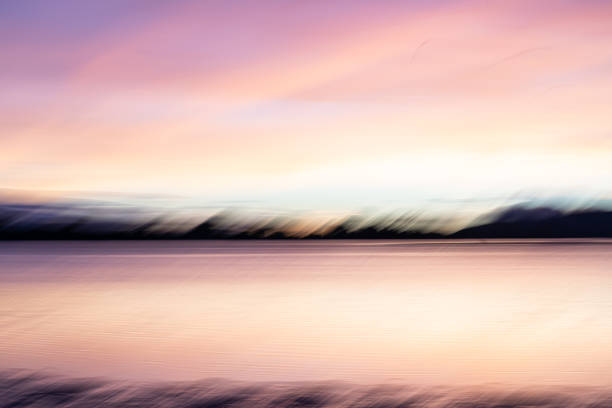 istock Background sunset intentional camera movement effect soft hues on morning light blue hour. 1983907656