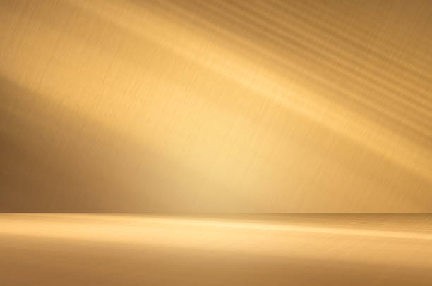 istock Wall interior background, studio and backdrops show products.with shadow from window color Gold. background for text insertion and presentation product 1983958104