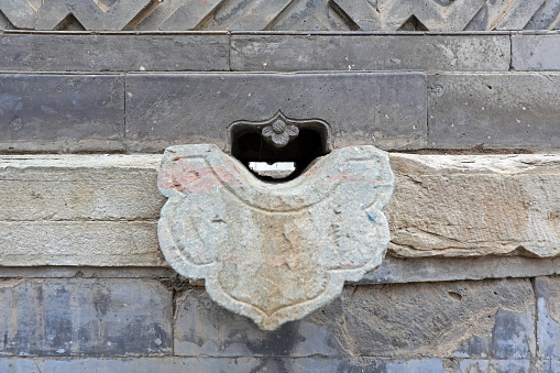 Water outlet on Chinese classical architecture, close-up photo