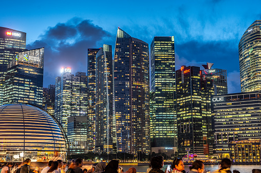 Singapore, 26 January 2024: Singapore's Marina Bay district illuminates night, glow of skyscrapers. vibrant lights transform cityscape into mesmerizing spectacle of urban brilliance and modernity