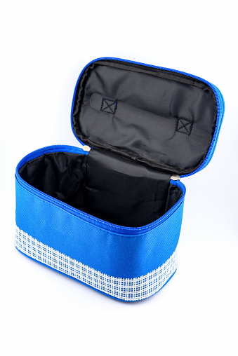 blue fabric bag with a zipper for small items or lunch, comfortable to carry, close-up on a white background