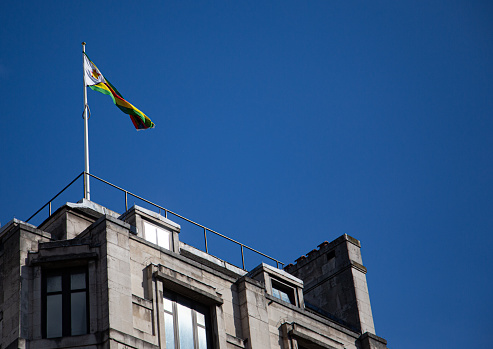 Top of the Zimbabwe Embassy within London, England UK flying their nations flag