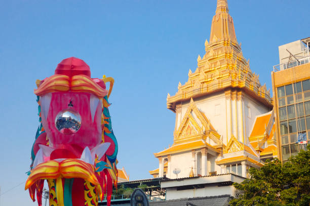 Rooftop and backside of Wat Traimit plus chinese new year dragon decor in Chinatown of Bangkok. Full name is Wat Traimit Withayaram Worawihan (Golden Buddha). Main entrance is at Charoen Krung Road, In bottom area is chinese new year dragon decor on street