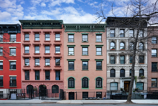 New York City old fashioned apartment buildings with ornate roof cornices